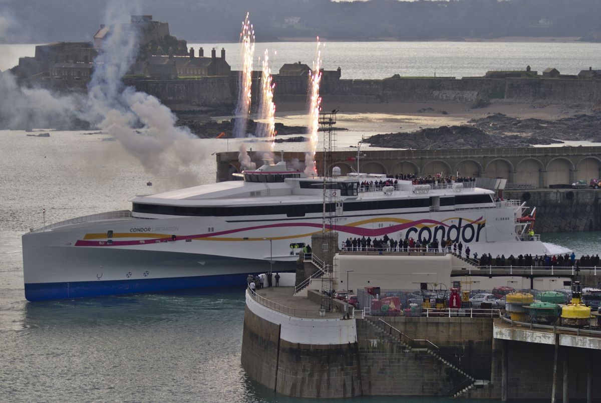 A large fast ferry entering St Helier harbour, Jersey, Channel Islands.