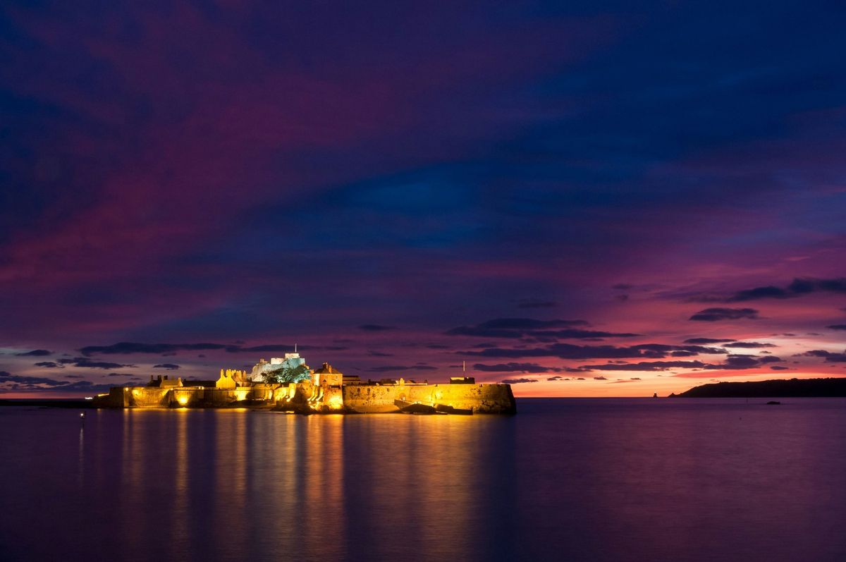 Elizabeth Castle at sunset off St Helier, Jersey, Channel Islands.